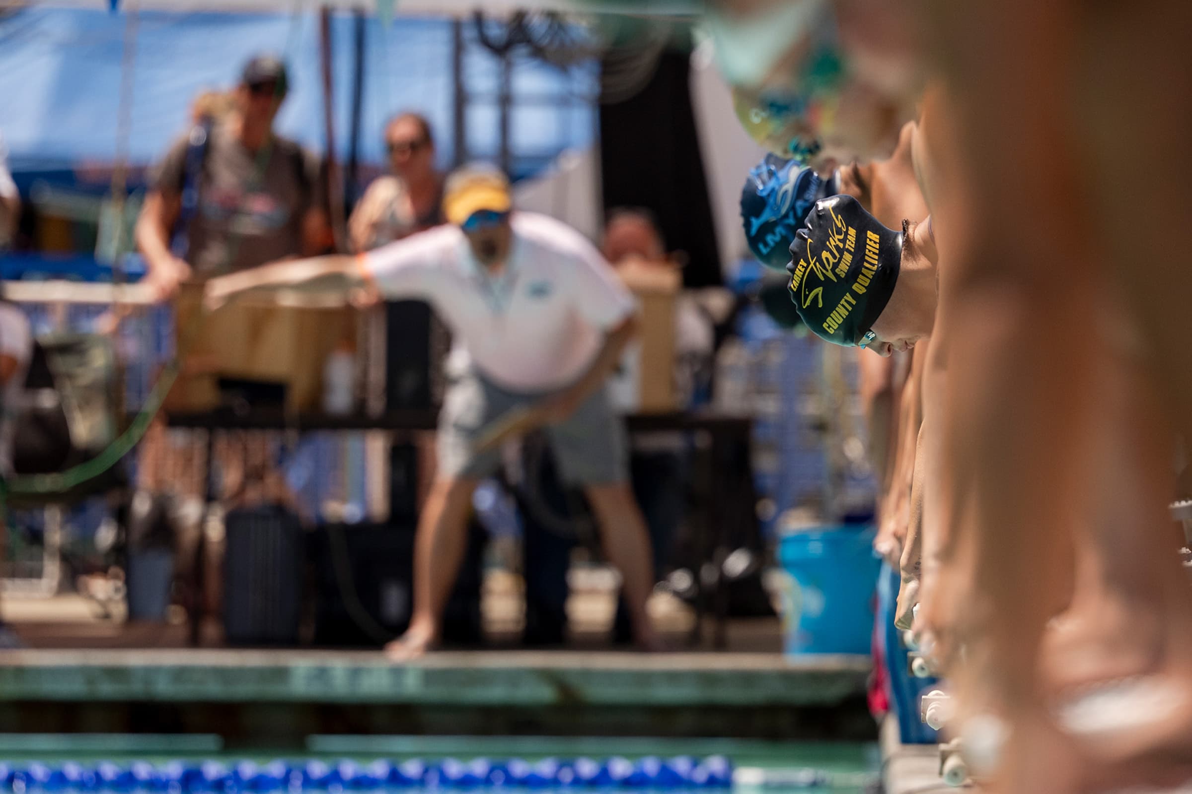 Swimmers on diving blocks